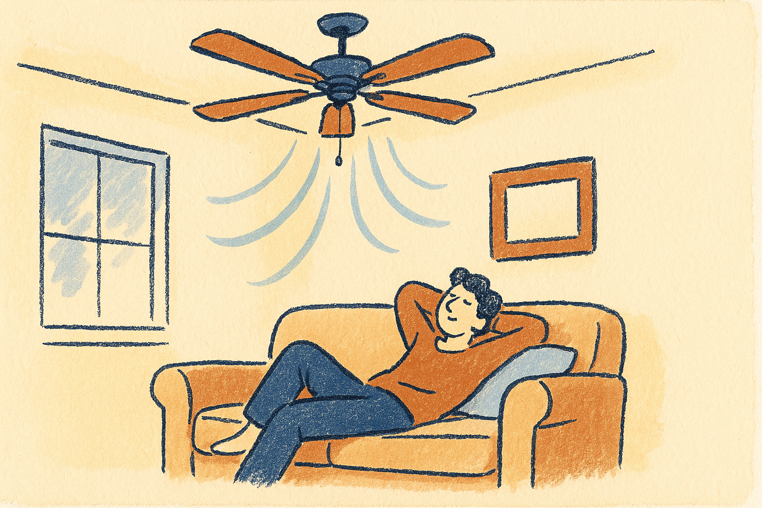 A person relaxing on a couch under a ceiling fan with a cool breeze